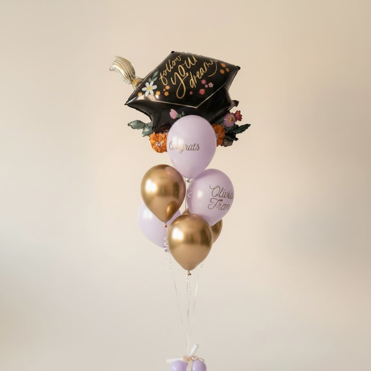 Purple and Gold Latex Balloons and a Jumbo Graduation Cap Mylar Balloon